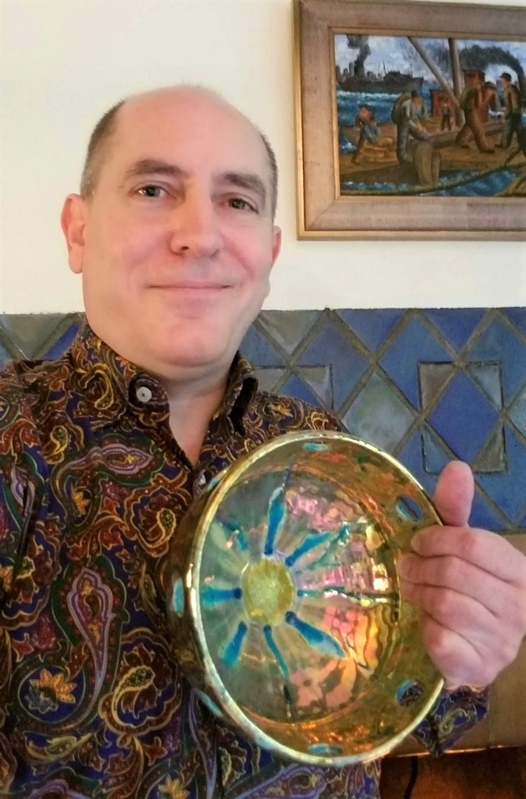 Artist Holding Golden Bowl